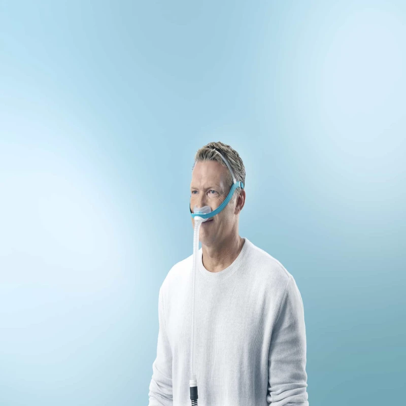 Fisher Paykel Evora nasal CPAP mask worn by patient for sleep therapy